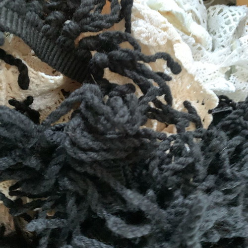 Set of threads, lace and ribbons for sewing used