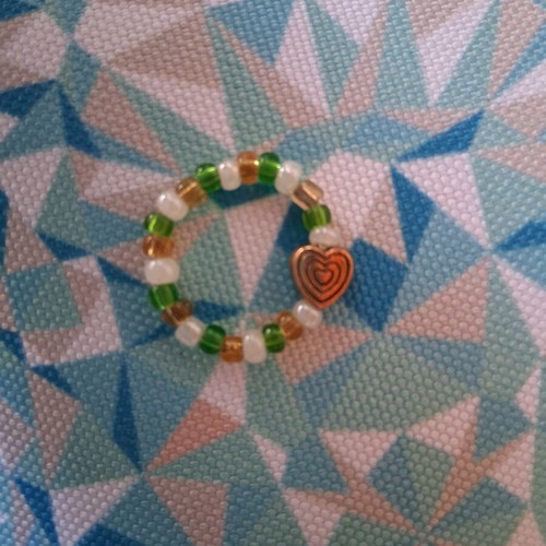 Elastic ring with beads and gold-colored heart, like new