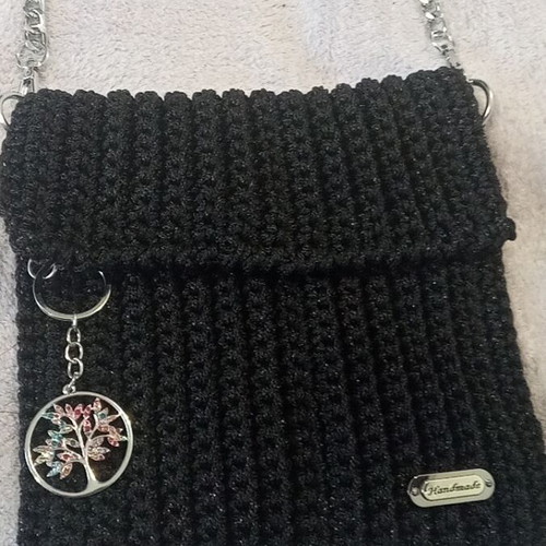 Handmade knitted black evening shoulder bag with silver chain and decoration