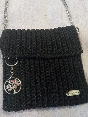 Handmade knitted black evening shoulder bag with silver chain and decoration