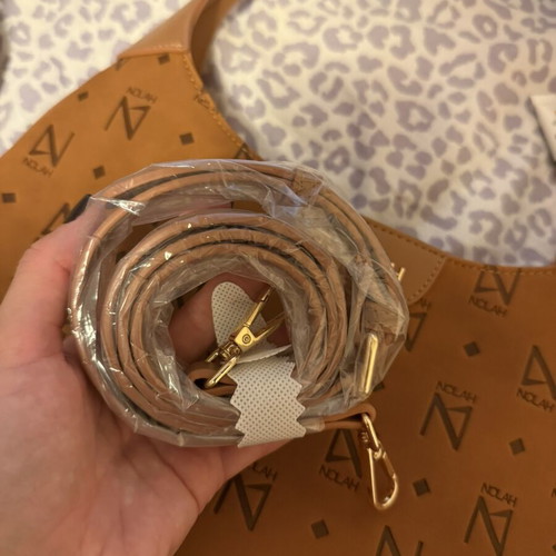 Nolah shoulder bag in camel and brown with monogram design