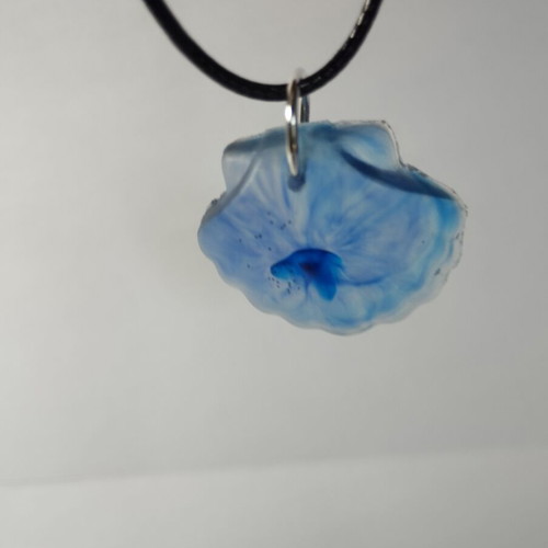 Handmade pendant with blue pigment in shell shape from resin, new