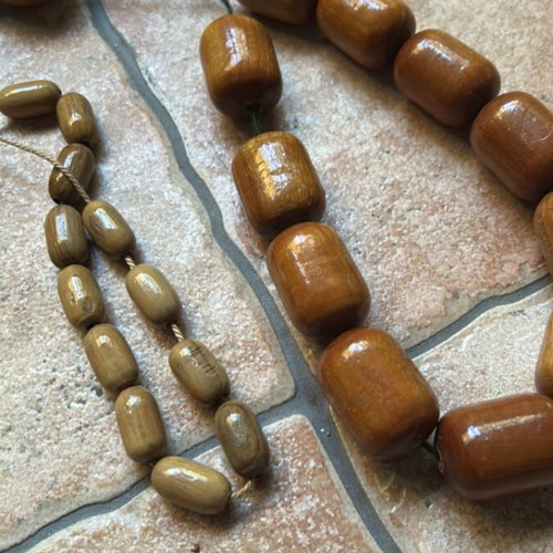 Decorative komboloi set like new, two wooden brown and one black and white