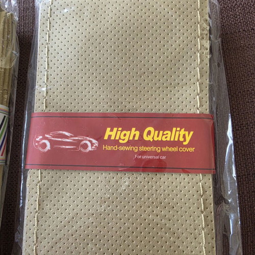 Steering wheel cover beige set of 2, new