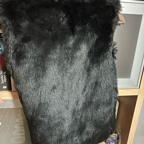 Sleeveless fur vest used, synthetic black short