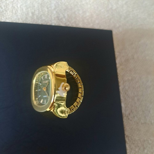 Ring watch with khaki dial and gold bracelet