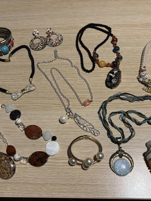 Jar treasure with assorted women's jewelry and accessories