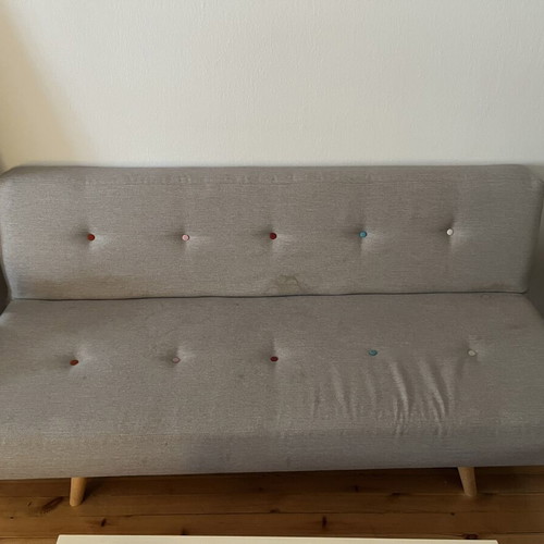 Sofa three-seater gray used with light stains