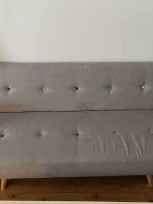 Sofa three-seater gray used with light stains