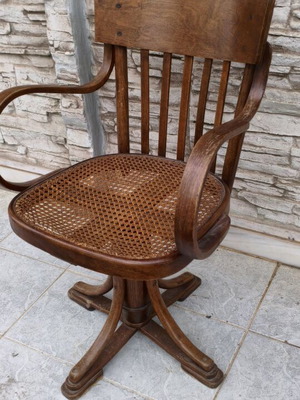 Swivel office chair used with small tear in cane seat