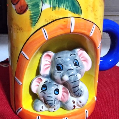 Decorative ceramic mugs set of 2 with embossed animal designs like new
