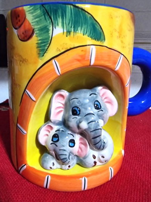 Decorative ceramic mugs set of 2 with embossed animal designs like new