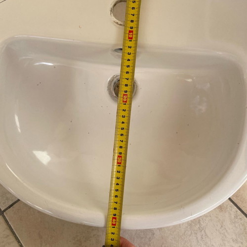 White bathroom sink used with minor small marks