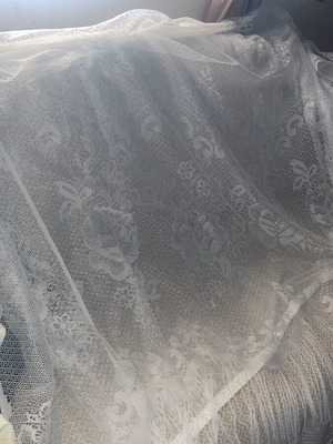 White vintage lace curtain with fringes