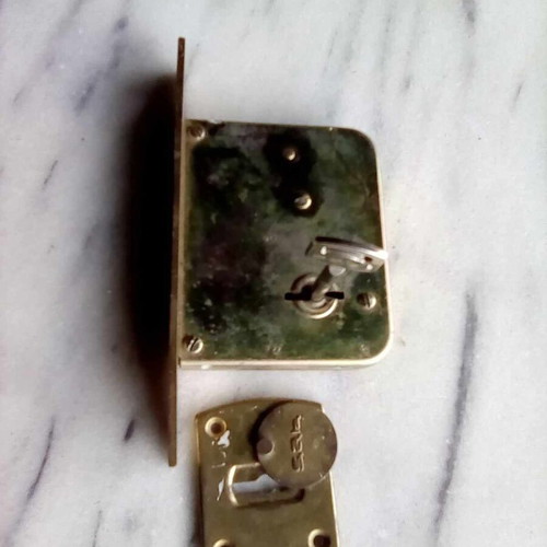 Triaina lock used with one key and metal keyhole cover