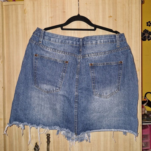 Pretty Little Thing blue denim skirt used, short with rips size 44