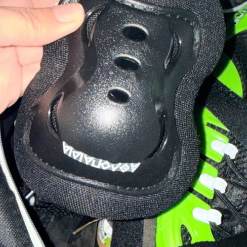 Rollers new, two pairs with knee pads, green-black and white-black