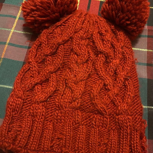Knitted hat used, burgundy Zara with two pom-poms