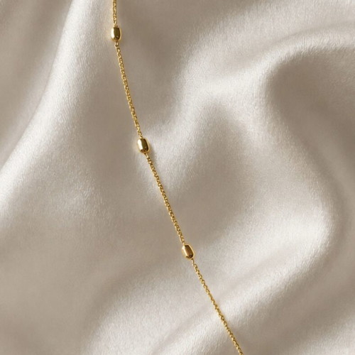 Steel necklace new, gold tone with blue beads and handmade motif