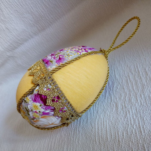 Decorative yellow floral egg used for Easter and spring decor
