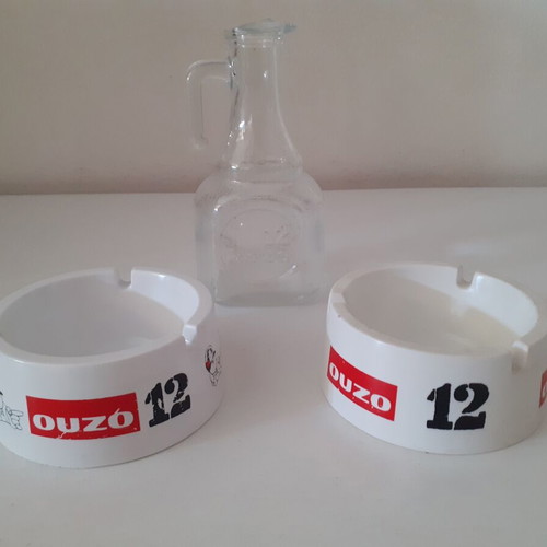 Ouzo 12 ashtrays and small jug like new