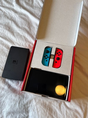 Nintendo Switch OLED with Neon Blue and Red Joy-Con and carrying case