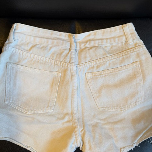 White denim shorts used, size small with distressed details