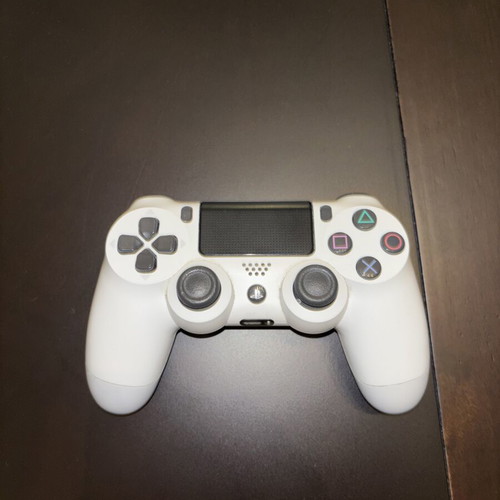 PlayStation 4 Slim used with controller and 7 games, 500GB