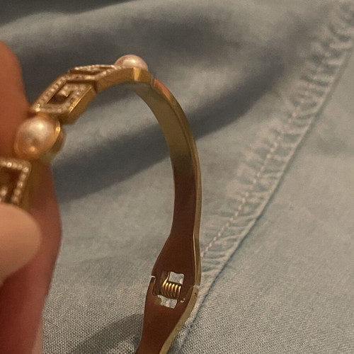 Steel bracelet used, gold color with meander design, crystals and pearls