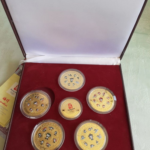 Beijing 2008 Friendlies gold-plated brass set, new, official commemorative edition