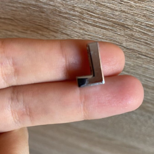 Decorative bead shaped like L, like new, silver