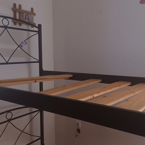Metal bunk beds with ladder and slats
