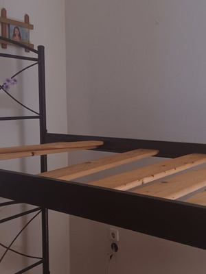 Metal bunk beds with ladder and slats