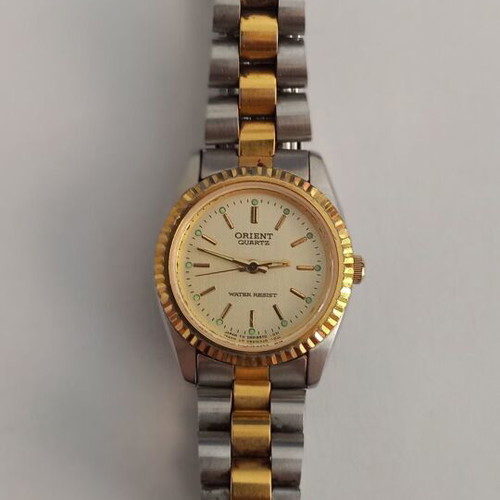Orient women's wristwatch used, quartz, gold bracelet