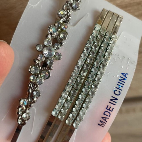 Hairpins used, silver shades with rhinestones