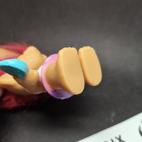 Troll Tennis Player figure with fuchsia hair and eyes