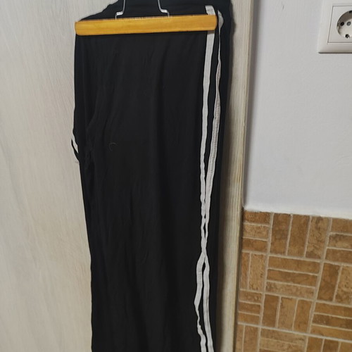 Black women's sports pants with white stripes, size L