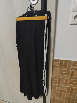 Black women's sports pants with white stripes, size L