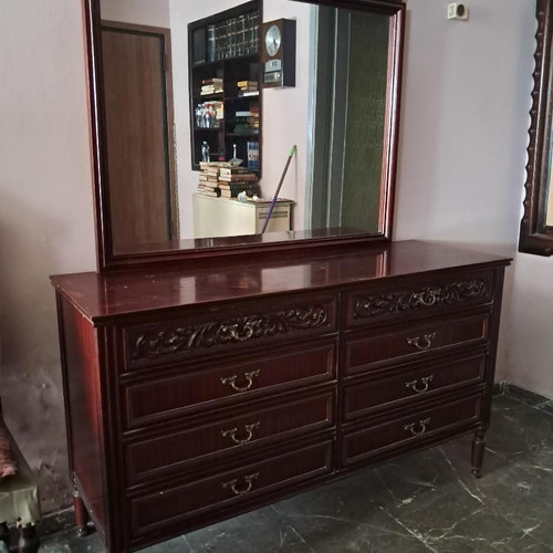 Wooden vintage bedroom furniture set used with signs of wear