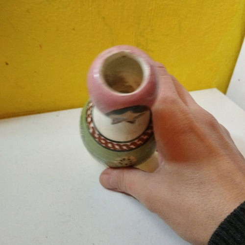 Ceramic vase used with folk costume for aromatic sticks