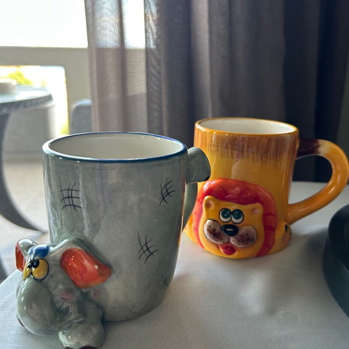 Children's ceramic mugs used, vintage with embossed elephant and lion