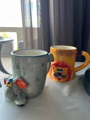 Children's ceramic mugs used, vintage with embossed elephant and lion