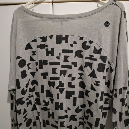 ALE long sleeve blouse with black print, like new