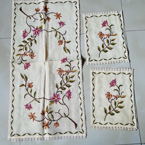 Set of handmade embroidered table linens used