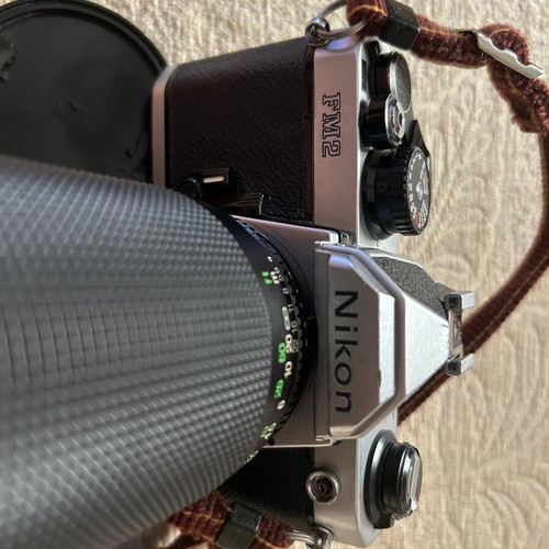 Nikon FM2 35 mm camera used with Telezon telephoto lens and lens cap