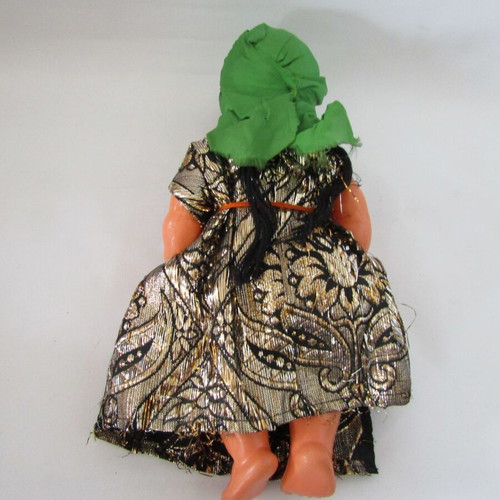 Vintage souvenir doll with traditional oriental costume used