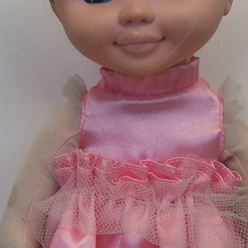 Vintage Uneeda doll with pink clothes, blond hair, blue eyes used
