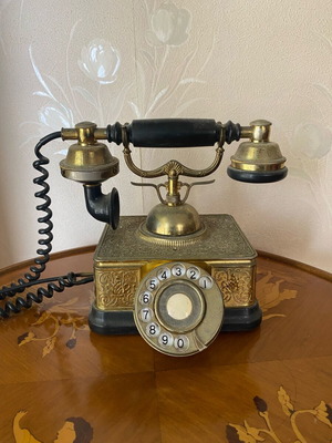 Vintage brass telephone used with embossed designs