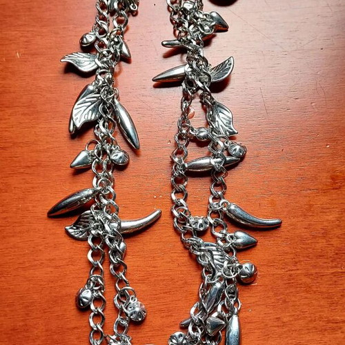 Silver Charm Necklace like new, long with leaf and drop pendants