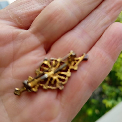 Vintage rhombus brooch with green stones used